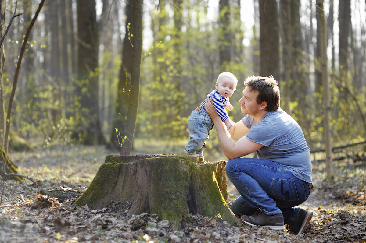 Father with his little baby boy in a spring forest