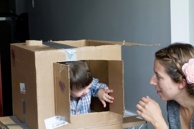 Woman playing hide and seek with her boy