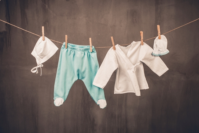 Baby clothes hanging on the clothesline