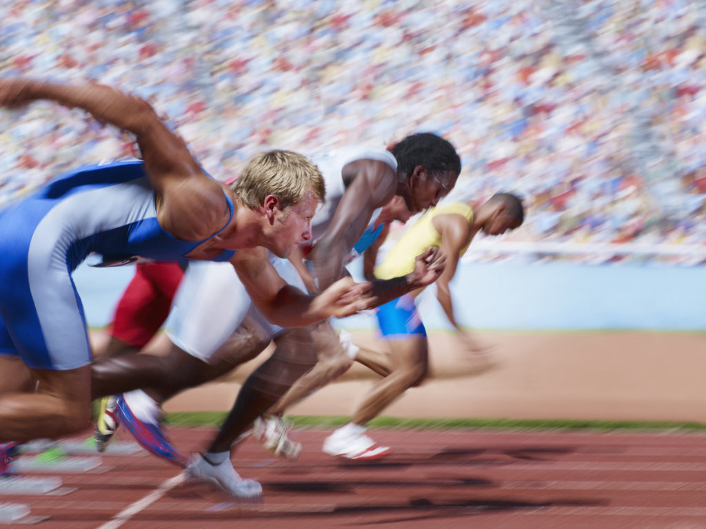 Racers at start line on running track
