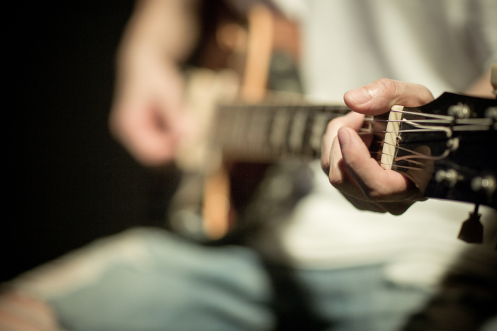 person-playing-a-guitar