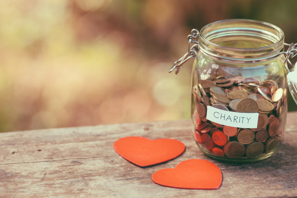 Glass jar for charity and two heart shapes