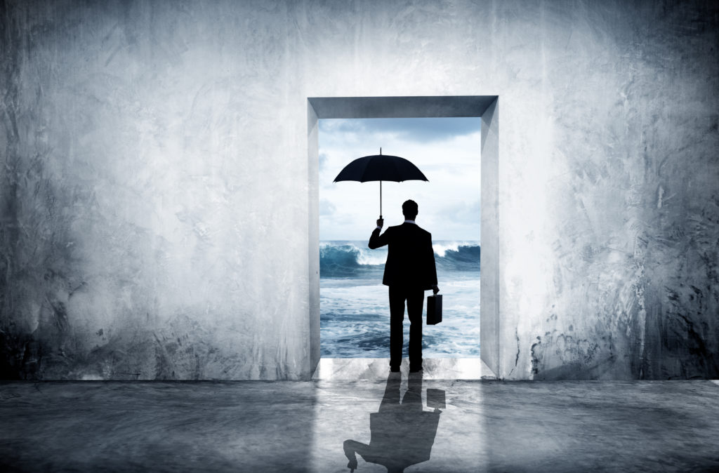 lonely businessman looking out of door with umbrella, concept for facing bankruptcy