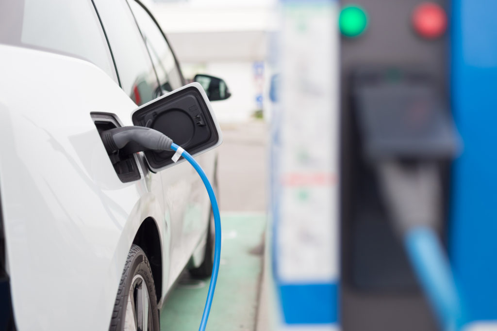 image of a car at an EV charging point, charging car