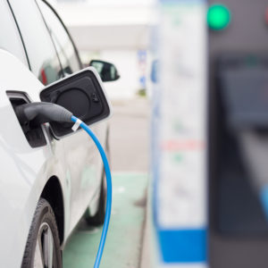 image of a car at an EV charging point, charging car