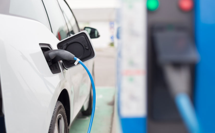 image of a car at an EV charging point, charging car