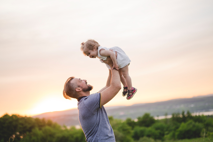 Beautiful portrait of young attractive father with daughter toddler