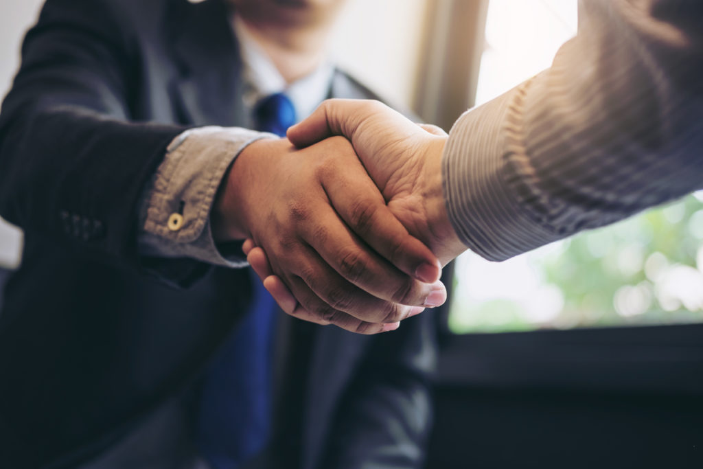 a photo of two people shaking hands