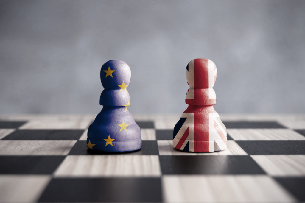 checkers pieces with UK and EU flags