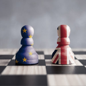 checkers pieces with UK and EU flags