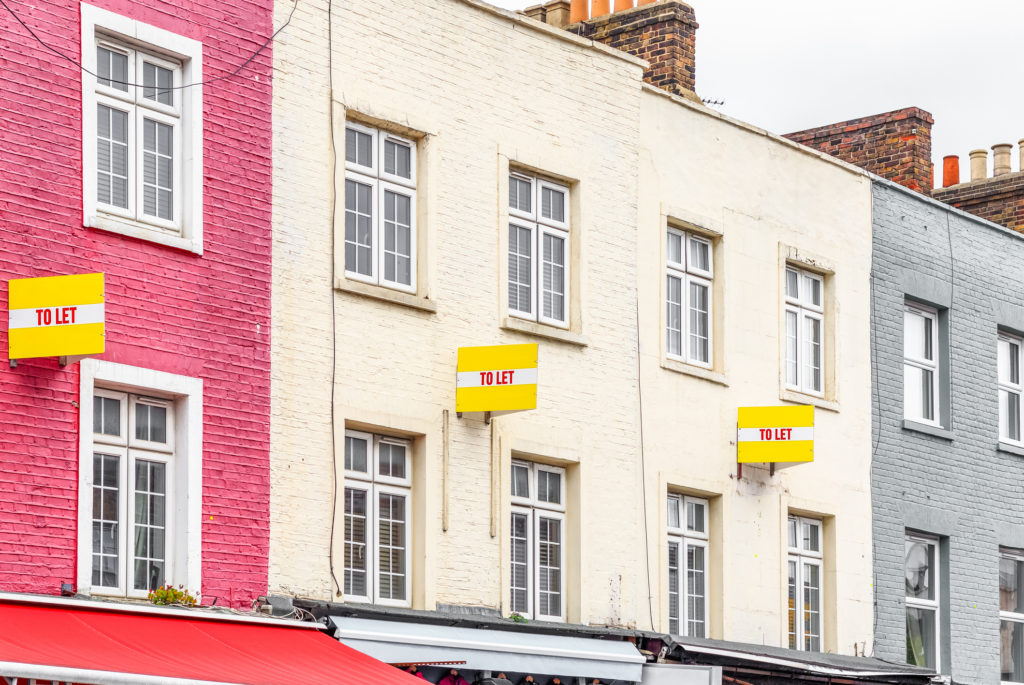 Colourful terraced houses with TO LET signs around Camden Town in London