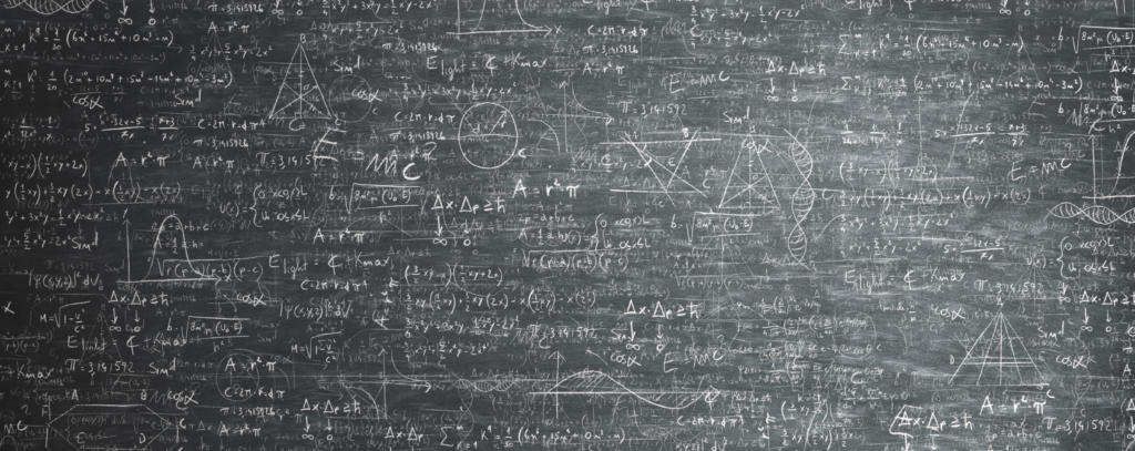 blackboard full of mathematical diagrams and equations