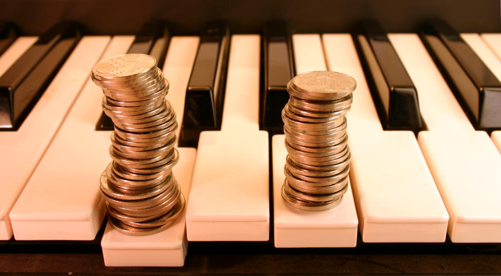 Piano keyboard and Coins. (earn from music)
