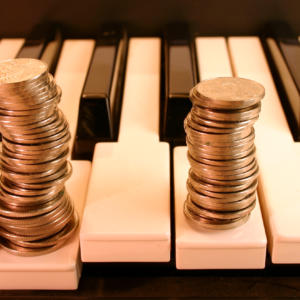 Piano keyboard and Coins. (earn from music)