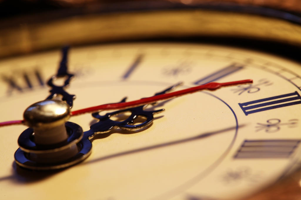 A close up photograph of a vintage clock face