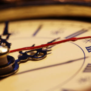 A close up photograph of a vintage clock face