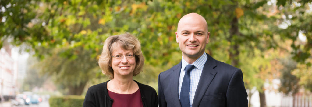 Two individuals, Liz Allen and Andrew Barton, posing for a photograph