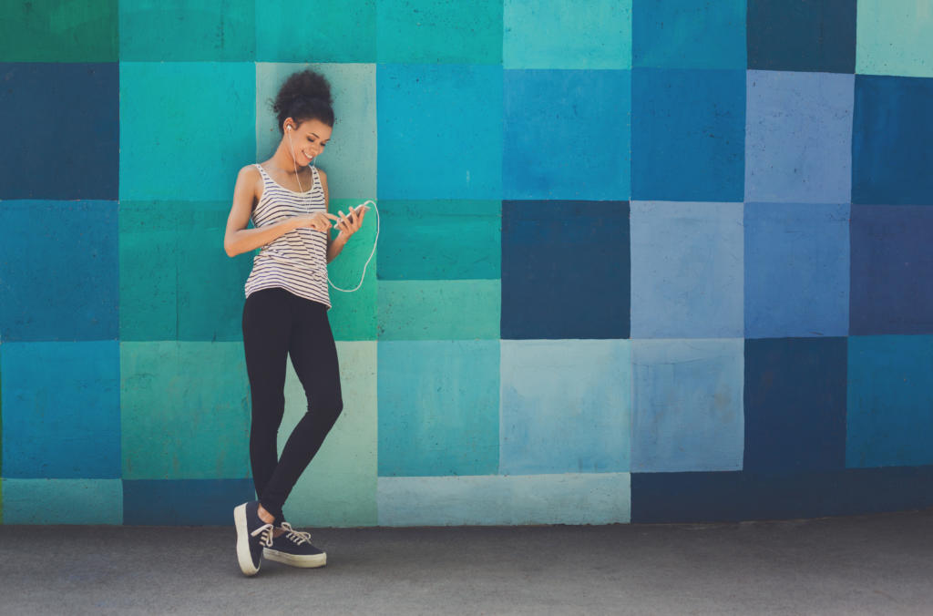 Young woman using her mp3 player