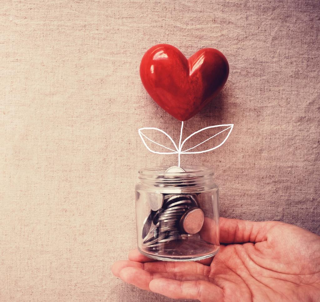 heart pebble in glass jar of coins