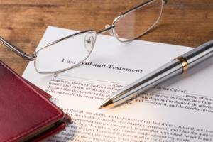 Glasses and pen with a Last Will and Testament