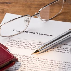 Glasses and pen with a Last Will and Testament