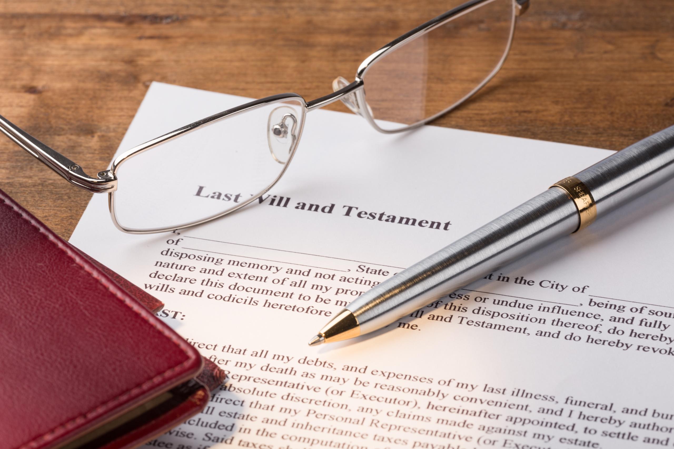 Glasses and pen with a Last Will and Testament