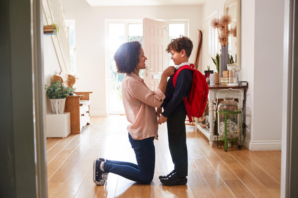 Testamentary Guardian - Single Mother At Home Getting Son Wearing Uniform Ready For First Day Of School