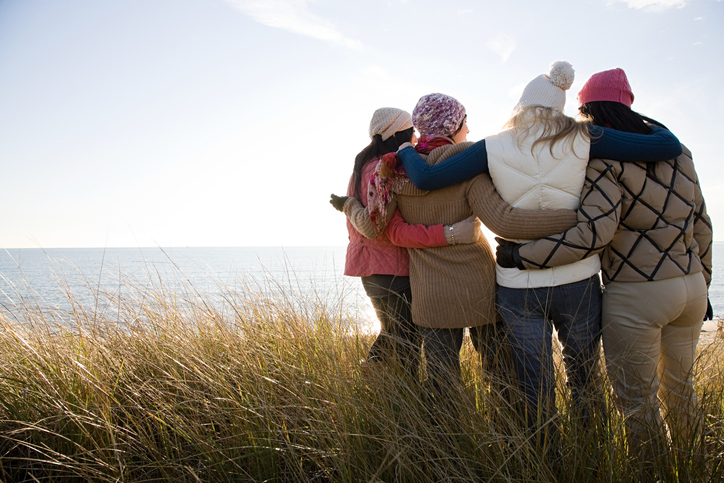 Female friends by the sea