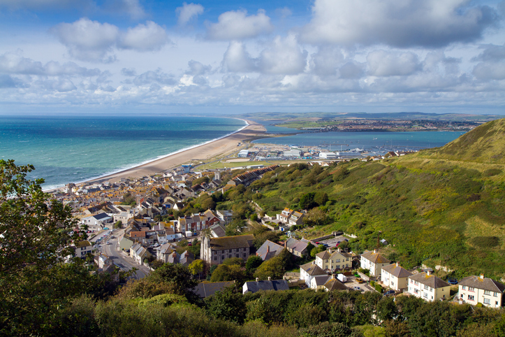 view overlooking Dorset beach town and coastline