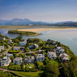 Ariel view of houses beach and bay share property