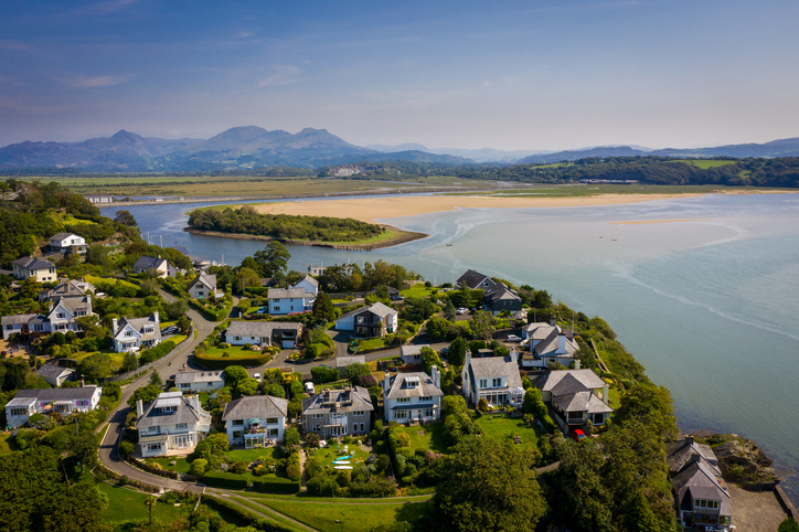 Ariel view of houses beach and bay share property