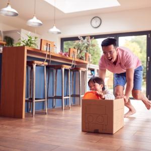 father and son playing at home