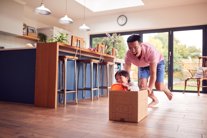 father and son playing at home