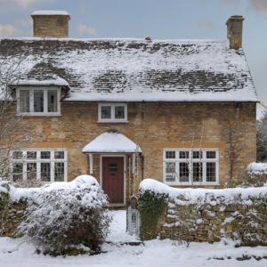 winter let holiday cottage in the snow