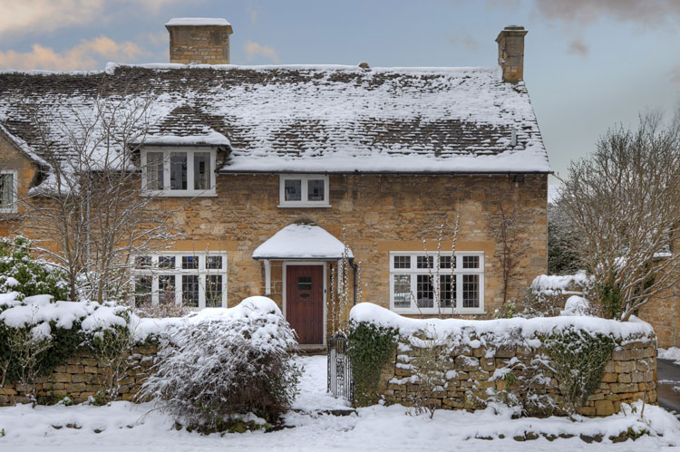 winter let holiday cottage in the snow