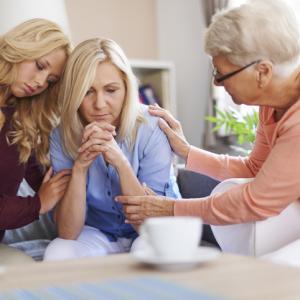 Three generations of women, comforting mother in the middle. Concept for deputies