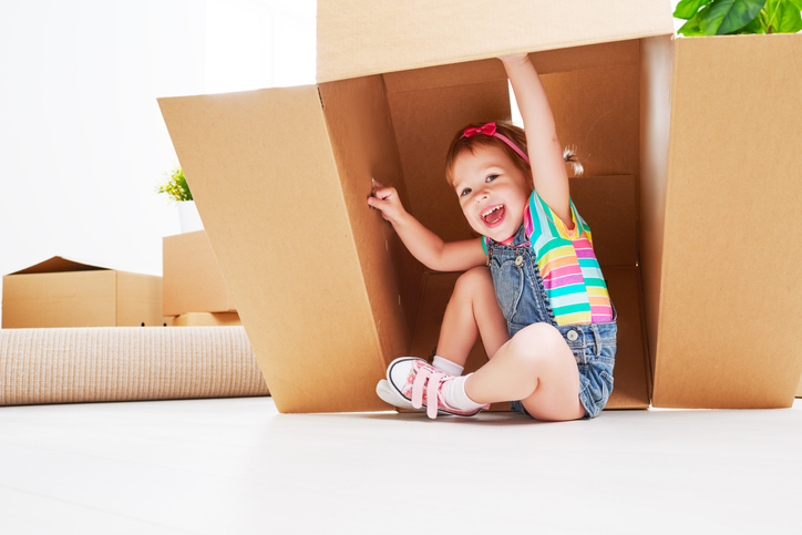 child in moving box, playing