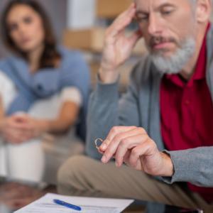 Photo showing a divorced couple discussing pension sharing when there is an age gap