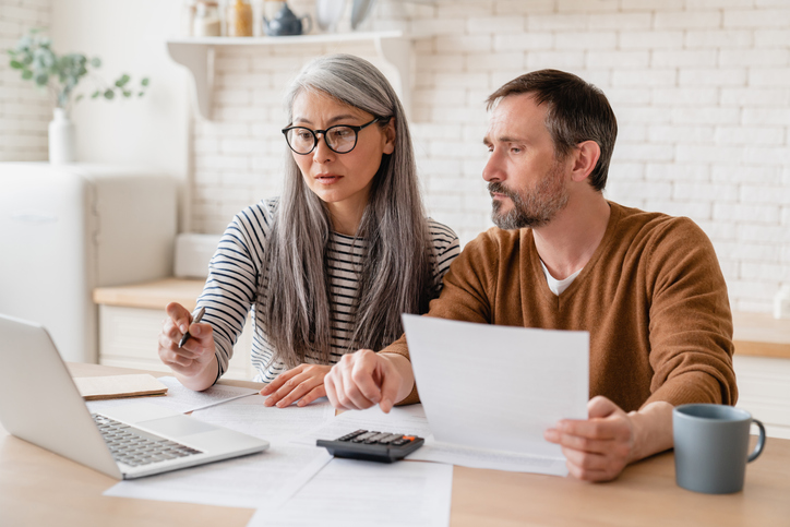 couple going through paperwork and files. concept for preparing for no fault divorce