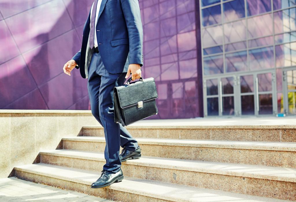 Image of businessman leaving office building