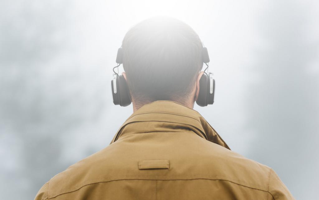 reaching a fair settlement - depicted by a man enjoying listening to music peacefully