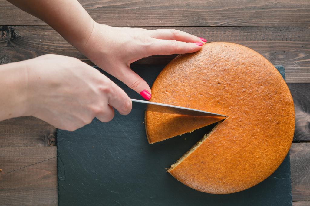 Woman hands cutting manna pie. Business diagram concept