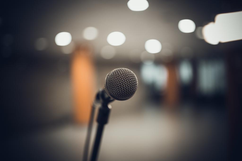 A close-up of a microphone in a conference room