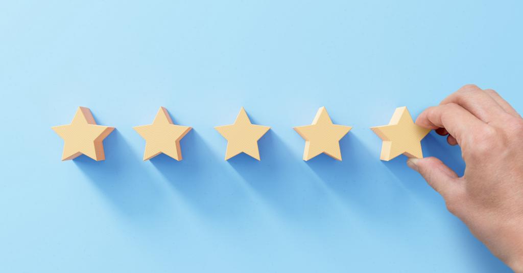 5 wooden stars on a blue background