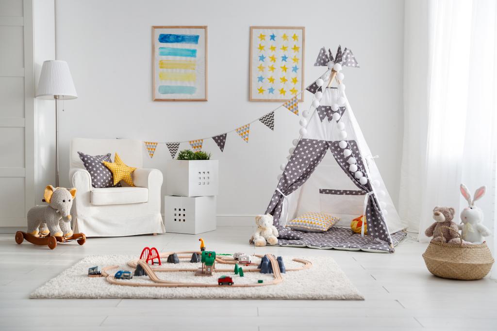 children's playroom with tent and toy railway