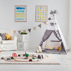 children's playroom with tent and toy railway
