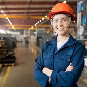 Young smiling female technician in blue uniform