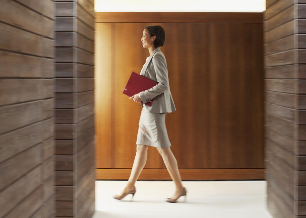 Solicitor walking in office corridor