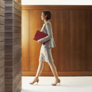 Solicitor walking in office corridor
