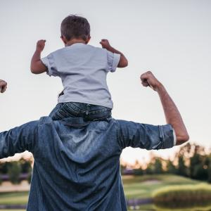 Dad and son having fun outdoors.